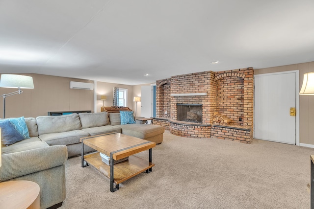 living room with light carpet, a fireplace, and a wall mounted AC