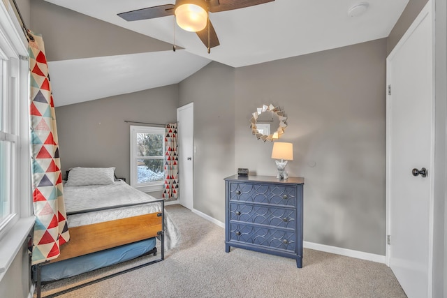 carpeted bedroom featuring vaulted ceiling, ceiling fan, and baseboards