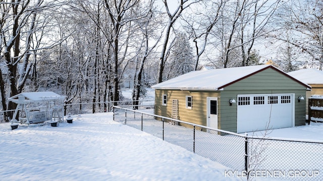 view of snow covered garage