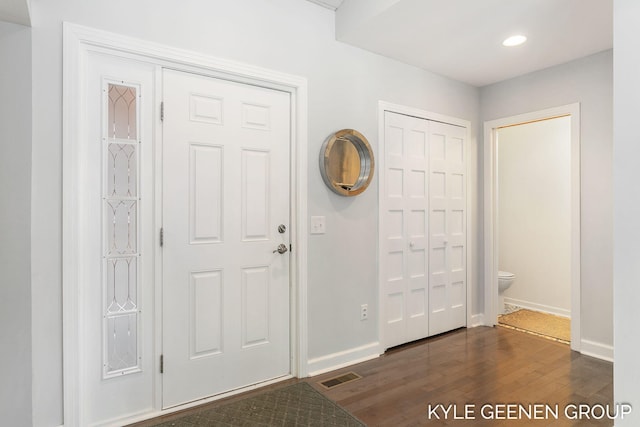 entrance foyer with dark hardwood / wood-style floors