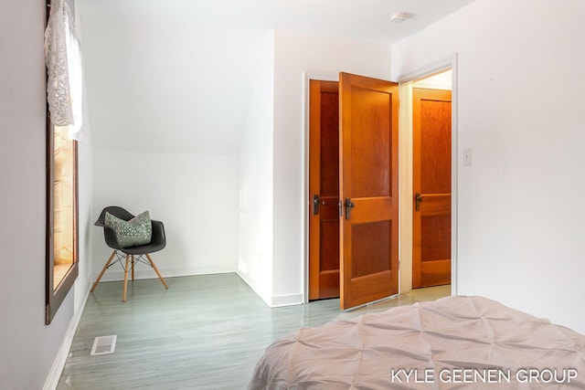 bedroom featuring hardwood / wood-style floors