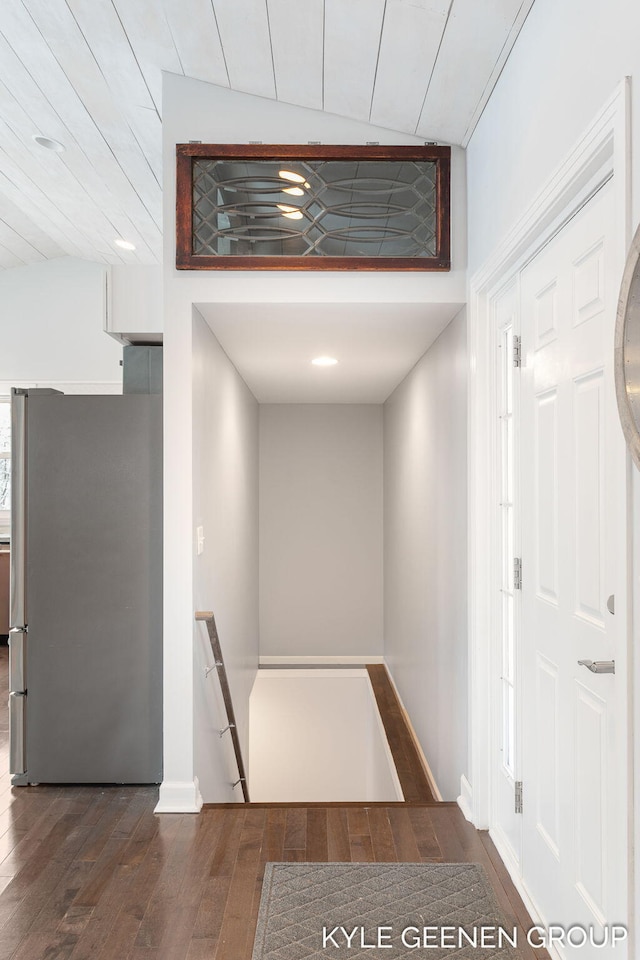 hallway with dark hardwood / wood-style flooring