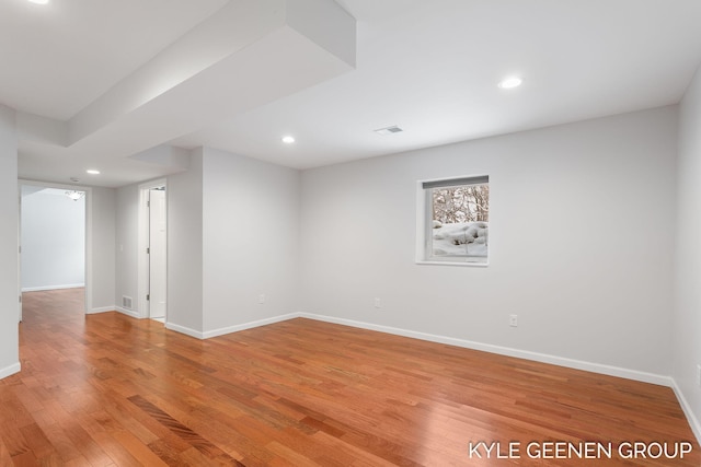 unfurnished room with hardwood / wood-style flooring