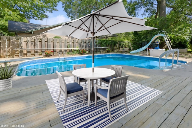 884 Oakridge Dr, Saint Joseph, MI 49085 - view of pool with a water slide, fence, a deck, and a fenced in pool