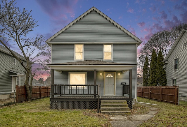 view of front property featuring a porch and a lawn