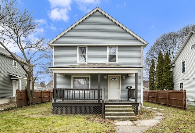 front of property featuring a front lawn and a porch