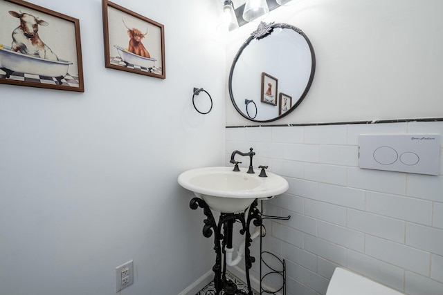 bathroom with tile walls