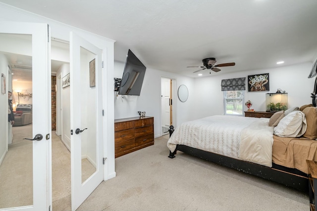 bedroom featuring light carpet and ceiling fan