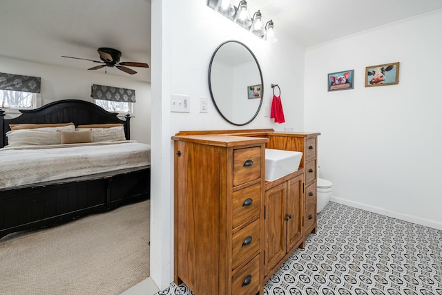 bathroom with ceiling fan, toilet, and vanity