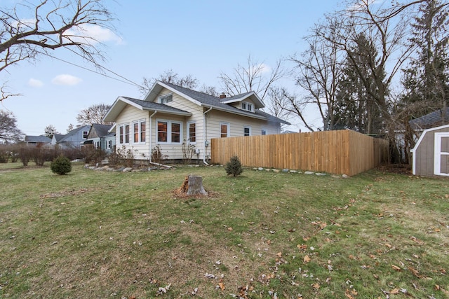 exterior space with a yard and a shed