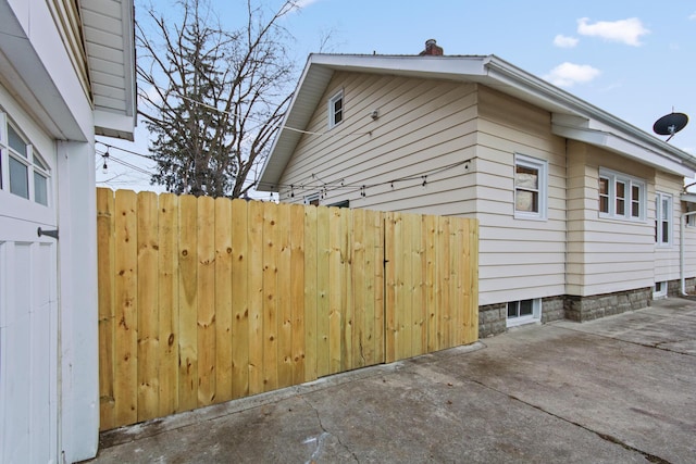 view of side of home featuring a patio