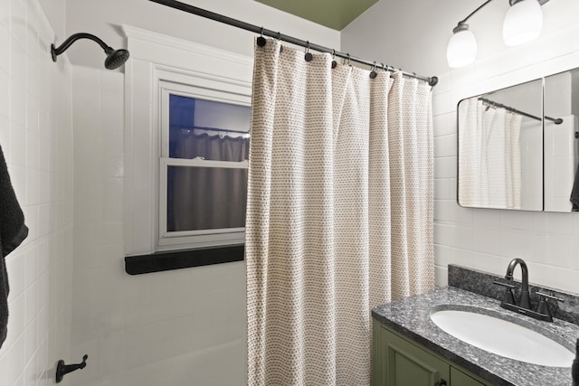 bathroom featuring vanity and shower / tub combo with curtain