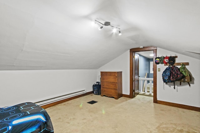 additional living space with carpet floors, vaulted ceiling, and a baseboard heating unit