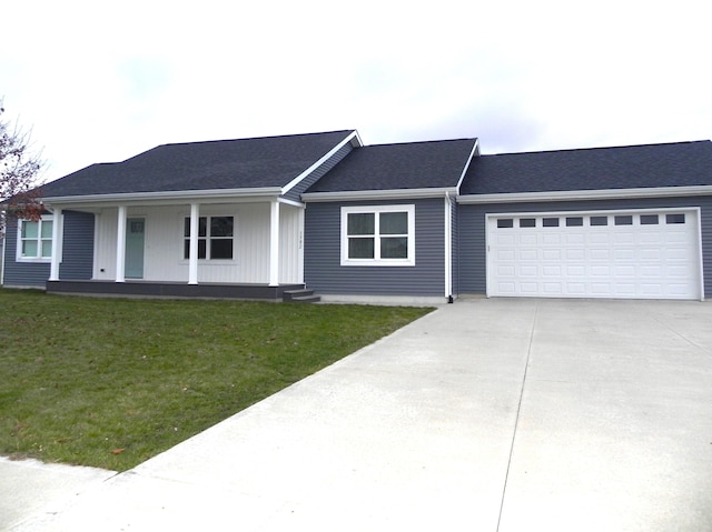 ranch-style house with a garage and a front lawn