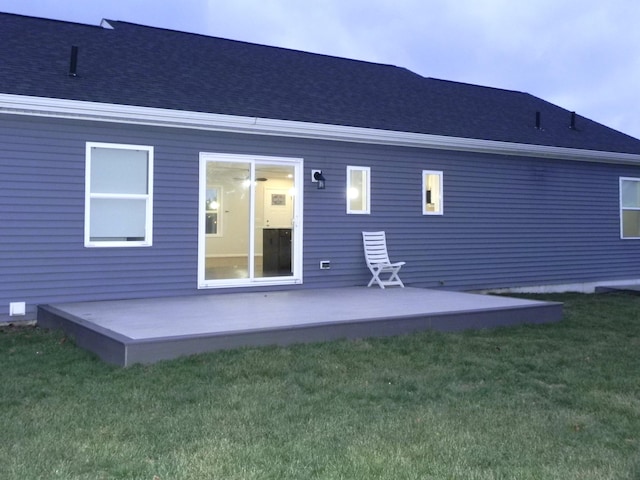 back of property featuring a lawn and a patio area