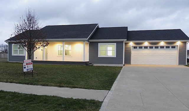 view of front facade with a front lawn and a garage