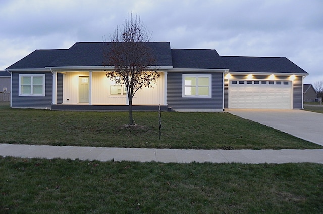 view of front facade with a front yard and a garage