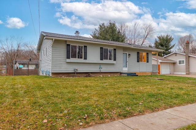 view of front facade featuring a front lawn and a garage