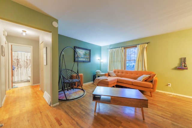 living room with light hardwood / wood-style floors