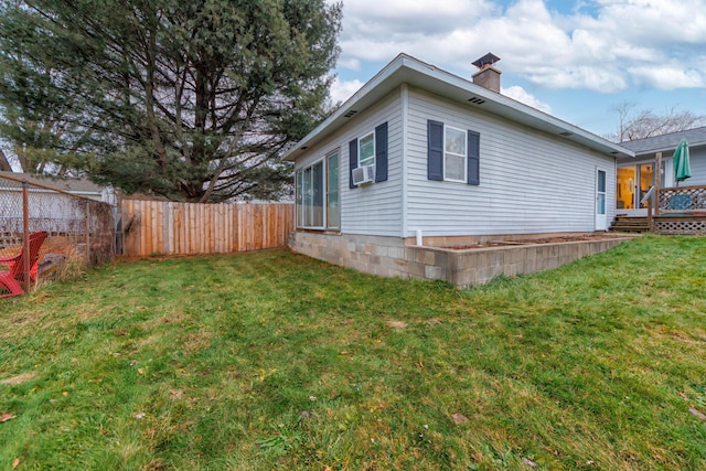 view of property exterior with a lawn and cooling unit