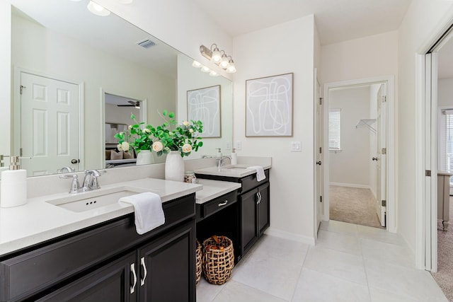 bathroom with tile patterned flooring and vanity