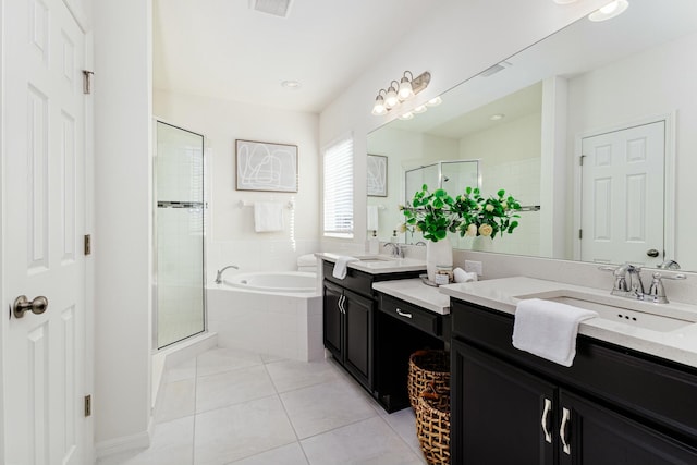 bathroom featuring tile patterned flooring, vanity, and separate shower and tub