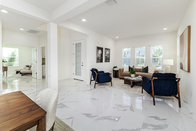 living room featuring beam ceiling