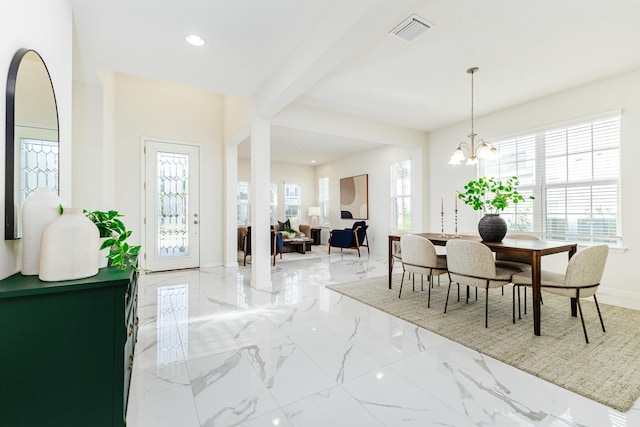 interior space featuring beamed ceiling and a chandelier