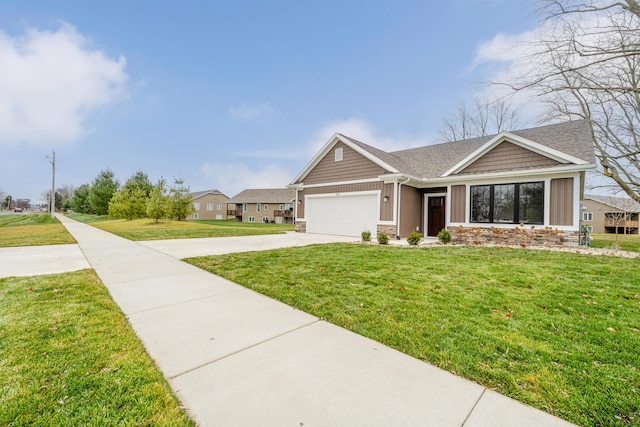 view of front of home with a garage and a front lawn