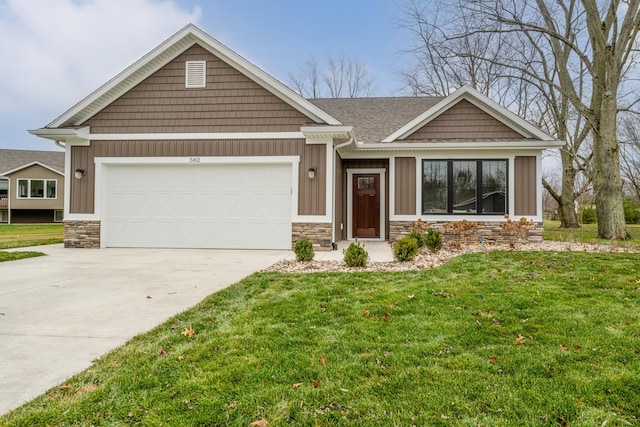 craftsman-style home with a garage and a front lawn