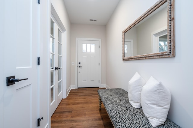 doorway with dark wood-type flooring