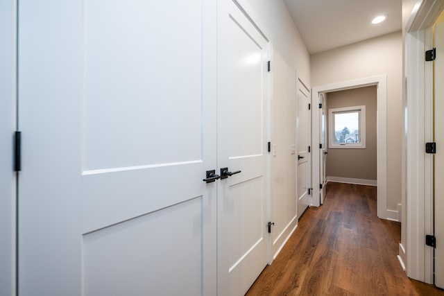 hallway with dark wood-type flooring