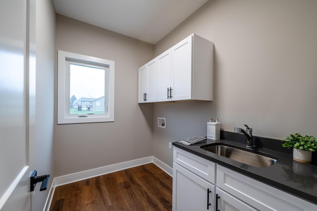 laundry room with dark hardwood / wood-style flooring, cabinets, sink, and hookup for a washing machine