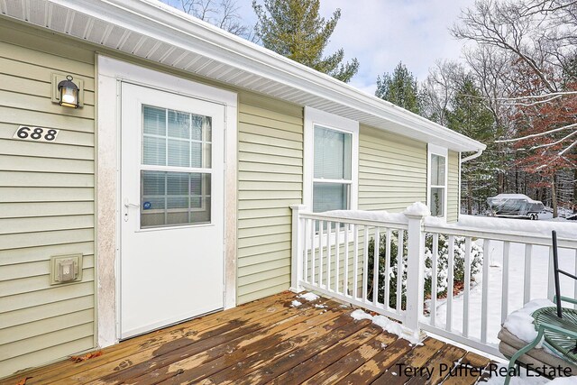 view of snow covered deck