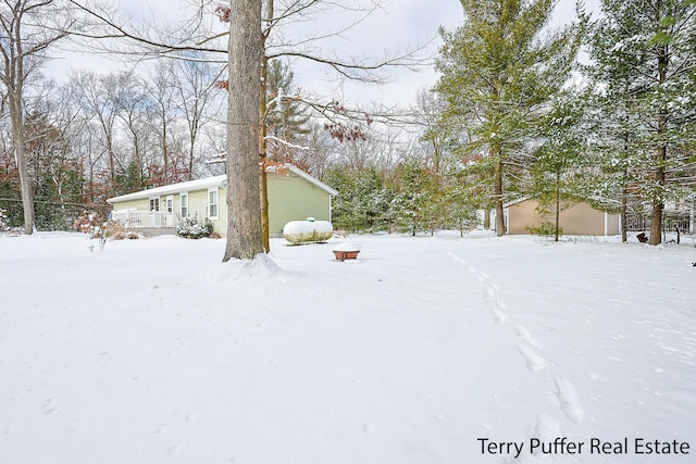 view of yard layered in snow