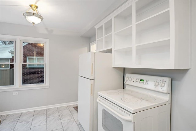 kitchen featuring white cabinetry and white electric stove