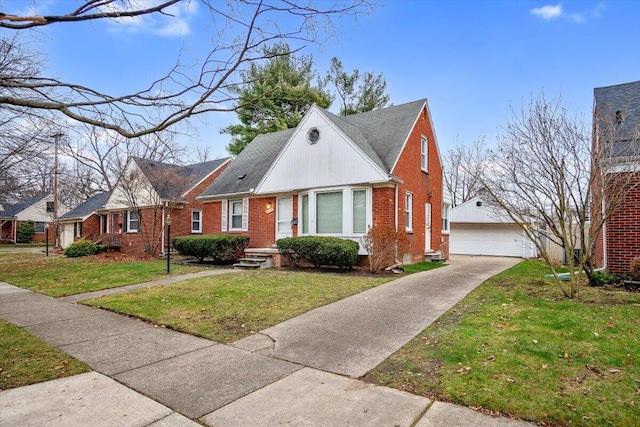 view of front of property featuring a front lawn, an outdoor structure, and a garage