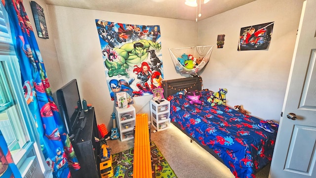 bedroom featuring carpet flooring and a textured ceiling