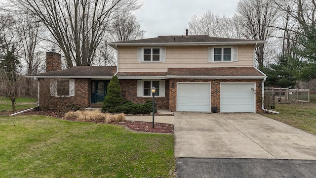 view of front of house with a garage and a front lawn