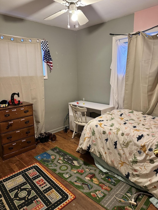 bedroom featuring ceiling fan and dark hardwood / wood-style floors