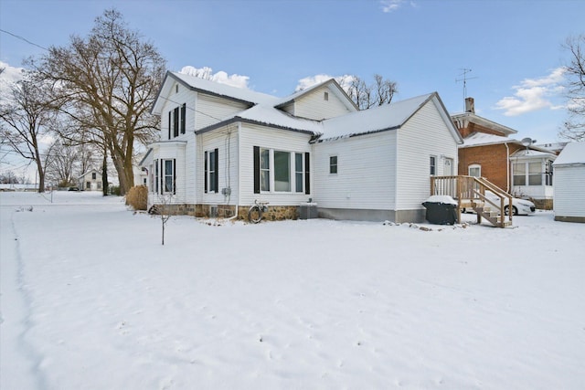 view of snow covered property