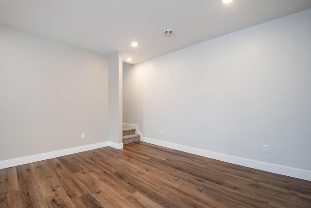 spare room with hardwood / wood-style flooring