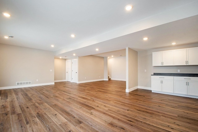 unfurnished living room with light hardwood / wood-style flooring