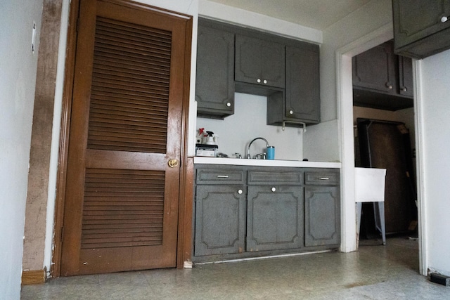 kitchen with gray cabinets and sink