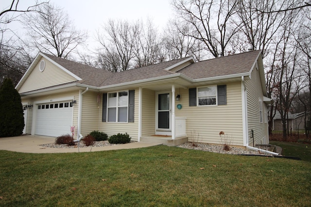 ranch-style house featuring a garage and a front yard