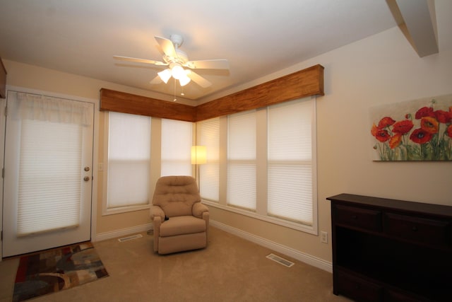 sitting room featuring carpet flooring and ceiling fan