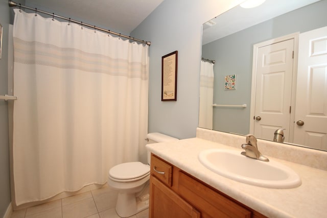 bathroom featuring tile patterned floors, vanity, and toilet