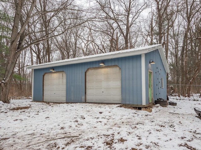 view of snow covered garage