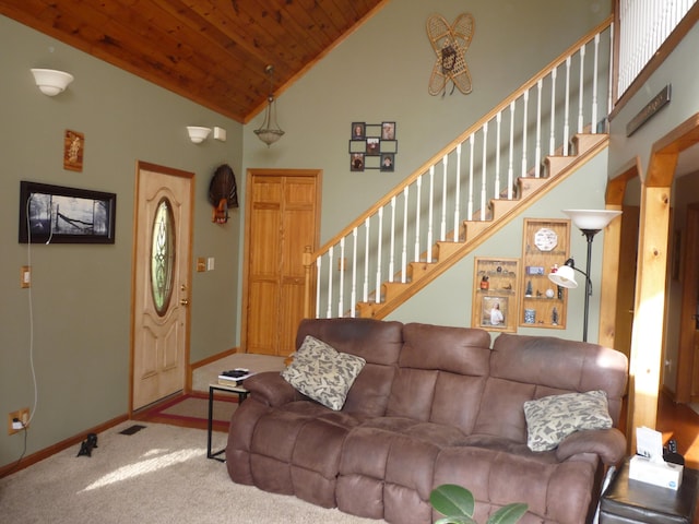 carpeted living room with high vaulted ceiling and wood ceiling