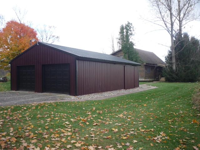 garage featuring a lawn